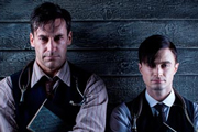 A Young Doctor's Notebook. Image shows from L to R: Older Doctor (Jon Hamm), Young Doctor (Daniel Radcliffe). Copyright: Big Talk Productions