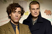 Dirk Gently. Image shows from L to R: Dirk Gently (Stephen Mangan), Richard MacDuff (Darren Boyd). Copyright: ITV Studios / The Welded Tandem Picture Company