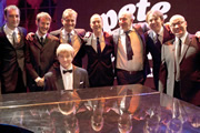 Pete And Dud: The Lost Sketches. Image shows from L to R: Alistair McGowan, Jonny Sweet, Pianist (Clifford Slapper), Hugh Dennis, Angus Deayton, Simon Day, Jonathan Ross, Adrian Edmondson. Copyright: Hot Sauce