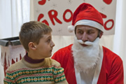 Little Crackers. Image shows from L to R: Young Chris (Robert Donnelly), Santa (Chris O'Dowd)