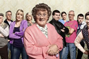 Mrs. Brown's Boys. Image shows from L to R: Grandad Brown (Dermot O'Neill), Mark Brown (Pat Shields), Cathy Brown (Jennifer Gibney), Betty Brown (Amanda Woods), Agnes Brown (Brendan O'Carroll), Dermot Brown (Paddy Houlihan), Maria Nicholson / Brown (Fiona O'Carroll), Rory Brown (Rory Cowan), Buster Brady (Danny O'Carroll), Winnie McGoogan (Eilish O'Carroll). Copyright: BBC / BocPix