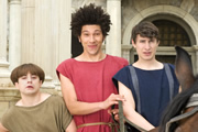 Plebs. Image shows from L to R: Grumio (Ryan Sampson), Stylax (Joel Fry), Marcus (Tom Rosenthal). Copyright: RISE Films