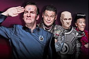 Red Dwarf. Image shows from L to R: Rimmer (Chris Barrie), Lister (Craig Charles), Kryten (Robert Llewellyn), Cat (Danny John-Jules). Copyright: Grant Naylor Productions / BBC