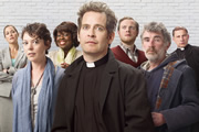 Rev.. Image shows from L to R: Ellie Pattman (Lucy Liemann), Alex Smallbone (Olivia Colman), Adoha Onyeka (Ellen Thomas), Rev Adam Smallbone (Tom Hollander), Nigel McCall (Miles Jupp), Colin Lambert (Steve Evets), Archdeacon Robert (Simon McBurney). Copyright: Big Talk Productions