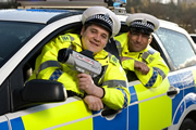 Scot Squad. Image shows from L to R: PC Michael Urquhart (Grant O'Rourke), PC Surjit Singh (Manjot Sumal). Copyright: The Comedy Unit