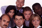 The Thin Blue Line. Image shows from L to R: D.I. Grim (David Haig), P.C. Habib (Mina Anwar), Inspector Fowler (Rowan Atkinson), P.C. Goody (James Dreyfus), D.C. Boyle (Mark Addy), Sergeant Dawkins (Serena Evans), P.C. Gladstone (Rudolph Walker). Copyright: Tiger Aspect Productions