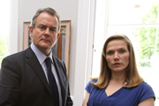 Twenty Twelve. Image shows from L to R: Ian Fletcher (Hugh Bonneville), Siobhan Sharpe (Jessica Hynes). Copyright: BBC