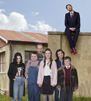 Moone Boy. Image shows from L to R: Trisha (Aoife Duffin), Sinead (Sarah White), Liam (Peter McDonald), Fidelma (Clare Monnelly), Debra (Deirdre O'Kane), Martin (David Rawle), Chris O'Dowd. Copyright: Baby Cow Productions / Sprout Pictures