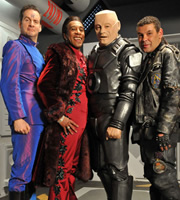 Red Dwarf. Image shows from L to R: Rimmer (Chris Barrie), Cat (Danny John-Jules), Kryten (Robert Llewellyn), Lister (Craig Charles). Copyright: Grant Naylor Productions / BBC