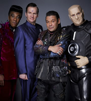 Red Dwarf. Image shows from L to R: Cat (Danny John-Jules), Rimmer (Chris Barrie), Lister (Craig Charles), Kryten (Robert Llewellyn). Copyright: Grant Naylor Productions / BBC