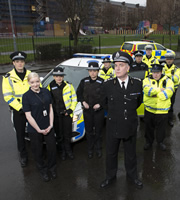 Scot Squad. Image shows from L to R: PC Charlie McIntosh (Chris Forbes), Maggie LeBeau (ML Stone), PC Jane Mackay (Ashley Smith), Sergeant Karen Ann Millar (Karen Bartke), PC Sarah Fletcher (Sally Reid), Chief Commissioner Cameron Miekelson (Jack Docherty), PC Jack McLaren (Jordan Young), PC Hugh McKirdy (Graeme Stevely), Officer/Acting Sgt. Ken Beattie (James Allenby-Kirk), PC Surjit Singh (Manjot Sumal). Copyright: The Comedy Unit