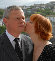 Doc Martin. Image shows from L to R: Dr Martin Ellingham (Martin Clunes), Edith Montgomery (Lia Williams). Copyright: Buffalo Pictures / Homerun Productions