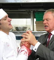 Doc Martin. Image shows from L to R: Junior Chef (Mathew Baynton), Dr Martin Ellingham (Martin Clunes). Copyright: Buffalo Pictures / Homerun Productions