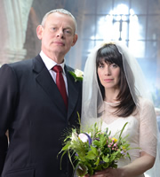 Doc Martin. Image shows from L to R: Dr Martin Ellingham (Martin Clunes), Louisa Glasson (Caroline Catz). Copyright: Buffalo Pictures / Homerun Productions