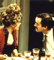 Fawlty Towers. Image shows from L to R: Sybil Fawlty (Prunella Scales), Basil Fawlty (John Cleese). Copyright: BBC