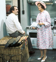 Fawlty Towers. Image shows from L to R: Basil Fawlty (John Cleese), Mrs White (Elizabeth Benson). Copyright: BBC