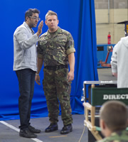 Gary: Tank Commander. Image shows from L to R: Advert Director (Sanjeev Kohli), Gary McLintoch (Greg McHugh). Copyright: The Comedy Unit