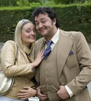 The Green Green Grass. Image shows from L to R: Katia (Morgana Robinson), Bryan (Ivan Kaye). Copyright: Shazam Productions