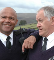 Last Of The Summer Wine. Image shows from L to R: PC Walsh (Louis Emerick), PC Cooper (Ken Kitson). Copyright: BBC