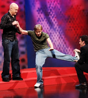 Man gets bummed by ghost whilst two people help. Image shows from L to R: Andy Parsons, Russell Howard, Adam Hills. Copyright: Angst Productions