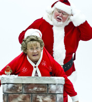 Mrs. Brown's Boys. Image shows from L to R: Agnes Brown (Brendan O'Carroll), Santa (Steven Wickham). Copyright: BBC / BocPix