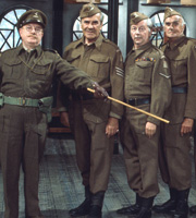 Perry And Croft: Made In Britain. Image shows from L to R: Captain Mainwaring (Arthur Lowe), Sergeant Wilson (John Le Mesurier), Lance Corporal Jones (Clive Dunn), Private Frazer (John Laurie). Copyright: BBC