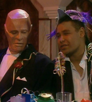 Red Dwarf. Image shows from L to R: Kryten (Robert Llewellyn), Lister (Craig Charles). Copyright: Grant Naylor Productions / BBC