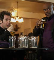 Rev.. Image shows from L to R: Rev Adam Smallbone (Tom Hollander), Leon (Colin Salmon). Copyright: Big Talk Productions