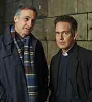 Rev.. Image shows from L to R: George (Nicholas Sidi), Rev Adam Smallbone (Tom Hollander). Copyright: Big Talk Productions