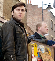 Rock & Chips. Image shows from L to R: Del Boy (James Buckley), Jumbo Mills (Lee Long). Copyright: Shazam Productions / BBC