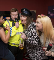 Scot Squad. Image shows from L to R: Officer/Acting Sgt. Ken Beattie (James Allenby-Kirk), Jamie-Leigh McGurk (Gayle Telfer Stevens). Copyright: The Comedy Unit