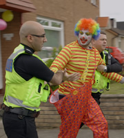 Scot Squad. Image shows left to right: PC Surjit Singh (Manjot Sumal), Bongo Buttons (John Gavin). Credit: The Comedy Unit