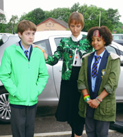 So Awkward. Image shows from L to R: Ollie Coulton (Archie Lyndhurst), Mrs Griggs (Susan Earl), Jas Salford (Ameerah Falzon-Ojo). Copyright: Channel X North