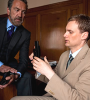 Spy. Image shows from L to R: The Examiner (Robert Lindsay), Tim (Darren Boyd). Copyright: Hat Trick Productions