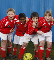 The Cup. Image shows from L to R: Gordy (Henry Smith), Ranjit Kaskar (Nazim Khan), Malky McConnell (Ceallach Spellman), Ali Farrell (Haylie Jones). Copyright: Hartswood Films Ltd