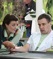 Trollied. Image shows from L to R: Katie (Chanel Cresswell), Kieran (Nick Blood). Copyright: Roughcut Television
