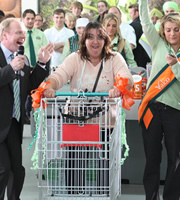 Trollied. Image shows from L to R: Gavin (Jason Watkins), Millionth Customer (Ashley McGuire), Katie (Chanel Cresswell). Copyright: Roughcut Television
