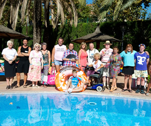 Benidorm. Image shows from L to R: Janey York (Crissy Rock), Mateo (Jake Canuso), Noreen Maltby (Elsie Kelly), Pauline (Selina Griffiths), Kenneth (Tony Maudsley), Gavin (Hugh Sachs), Michael Garvey (Oliver Stokes), Janice Garvey (Siobhan Finneran), Mick Garvey (Steve Pemberton), Madge (Sheila Reid), Donald Stewart (Kenny Ireland), Jacqueline Stewart (Janine Duvitski), Les / Lesley (Tim Healy), Liam (Adam Gillen). Copyright: Tiger Aspect Productions