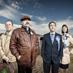 Bob Servant. Image shows from L to R: Frank (Jonathan Watson), Bob Servant (Brian Cox), Nick Edwards (Rufus Jones), Phillippa Edwards (Pollyanna McIntosh). Copyright: BBC