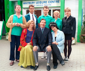 The Brittas Empire. Image shows from L to R: Colin Wetherby (Mike Burns), Helen Brittas (Pippa Haywood), Gavin Featherly (Tim Marriott), Gordon Brittas (Chris Barrie), Tim Whistler (Russell Porter), Carole Parkinson (Harriet Thorpe), Linda (Jill Greenacre), Julie (Judy Flynn). Copyright: BBC