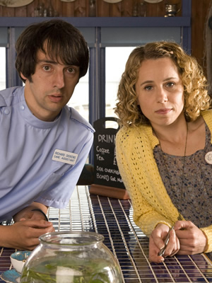 The Café. Image shows from L to R: Richard Dickens (Ralf Little), Sarah Porter (Michelle Terry). Copyright: Jellylegs