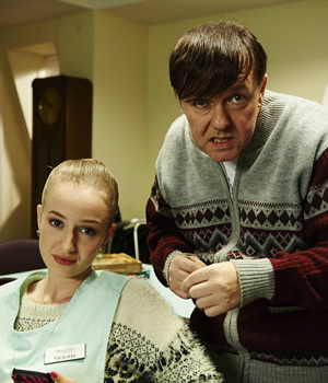 Derek. Image shows from L to R: Vicky (Holli Dempsey), Derek (Ricky Gervais). Copyright: Derek Productions