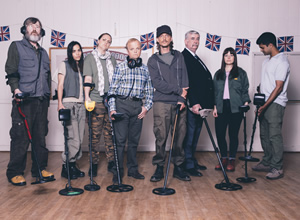 Detectorists. Image shows from L to R: Russell (Pearce Quigley), Varde (Orion Ben), Louise (Laura Checkley), Lance Stater (Toby Jones), Andy Stone (Mackenzie Crook), Terry (Gerard Horan), Sophie (Aimee-Ffion Edwards), Hugh (Divian Ladwa). Copyright: Channel X / Lola Entertainment