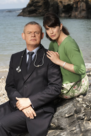 Doc Martin. Image shows from L to R: Dr Martin Ellingham (Martin Clunes), Louisa Glasson (Caroline Catz). Copyright: Buffalo Pictures / Homerun Productions