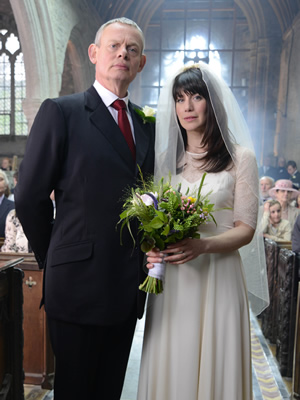 Doc Martin. Image shows from L to R: Dr Martin Ellingham (Martin Clunes), Louisa Glasson (Caroline Catz). Copyright: Buffalo Pictures / Homerun Productions