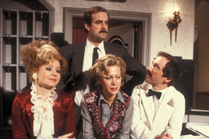 Fawlty Towers. Image shows from L to R: Sybil Fawlty (Prunella Scales), Basil Fawlty (John Cleese), Polly (Connie Booth), Manuel (Andrew Sachs). Copyright: BBC