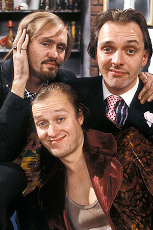 Filthy Rich & Catflap. Image shows left to right: Ralph Filthy (Nigel Planer), Eddie Catflap (Adrian Edmondson), Richie Rich (Rik Mayall). Credit: BBC