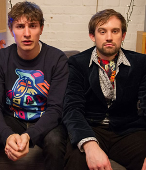 Flat TV. Image shows from L to R: Tom (Tom Rosenthal), Naz (Naz Osmanoglu). Copyright: BBC