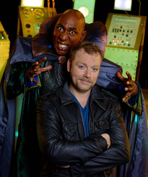 Hounded. Image shows from L to R: Dr Muhahahaha (Colin McFarlane), Rufus (Rufus Hound). Copyright: BBC