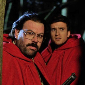 Murder In Successville. Image shows from L to R: DI Sleet (Tom Davis), Greg James. Copyright: Tiger Aspect Productions